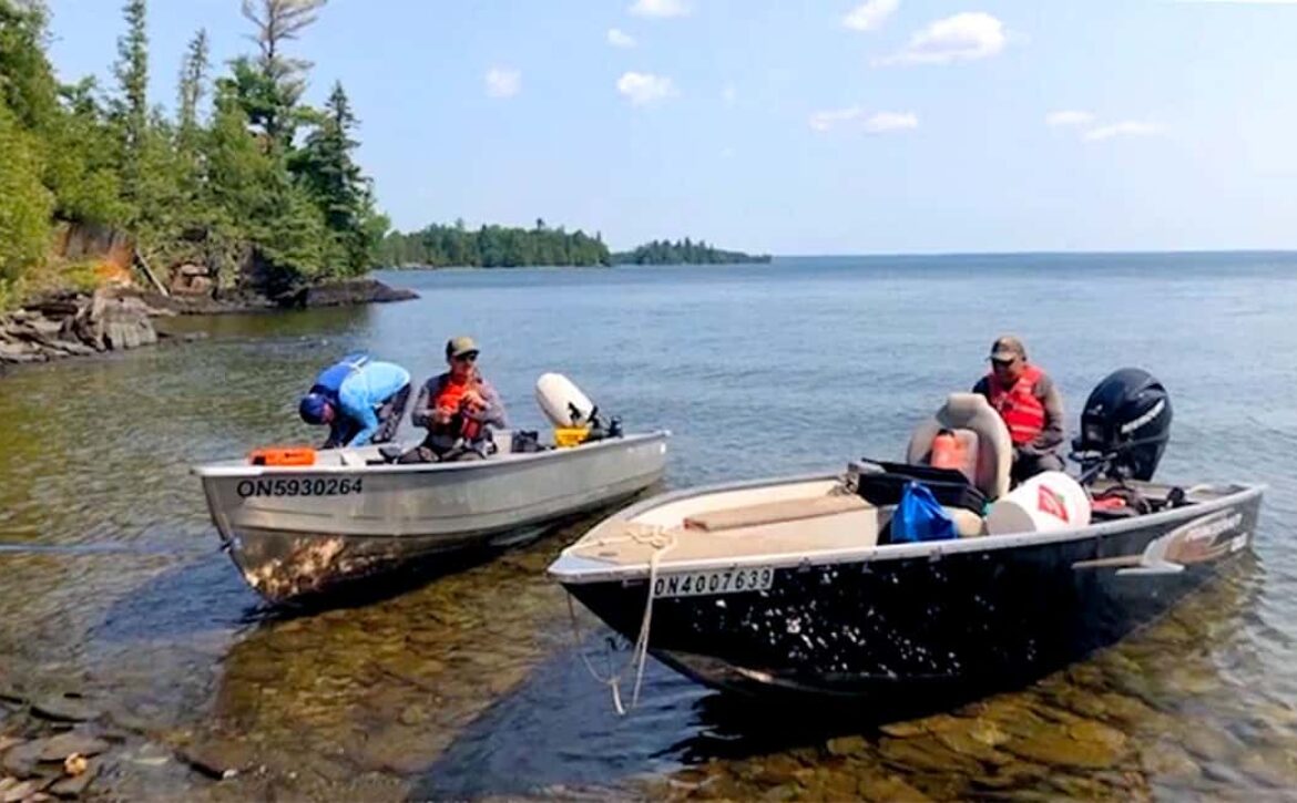 photo of research team in two motorboats