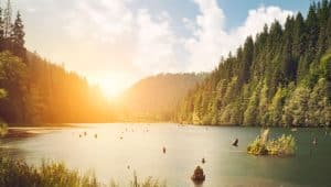 Mountains scene with sunset on the lake