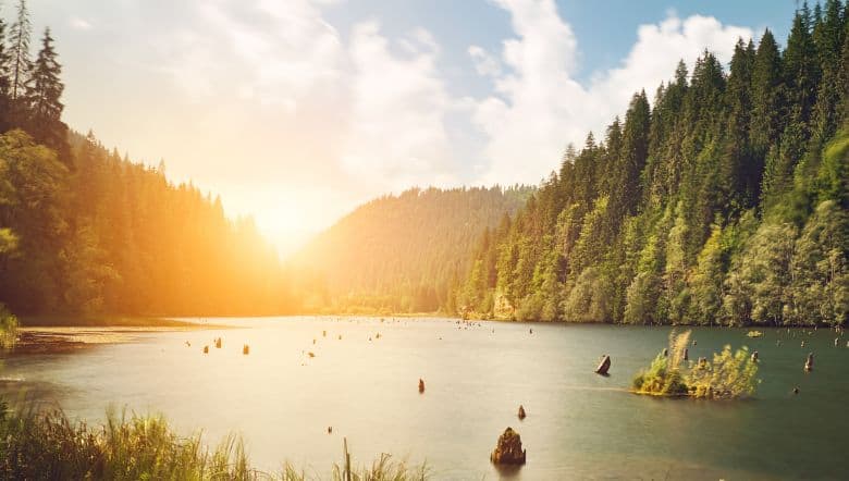 Mountains scene with sunset on the lake